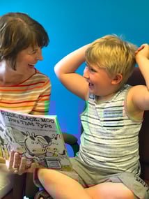 Deb reading to her Book Buddy