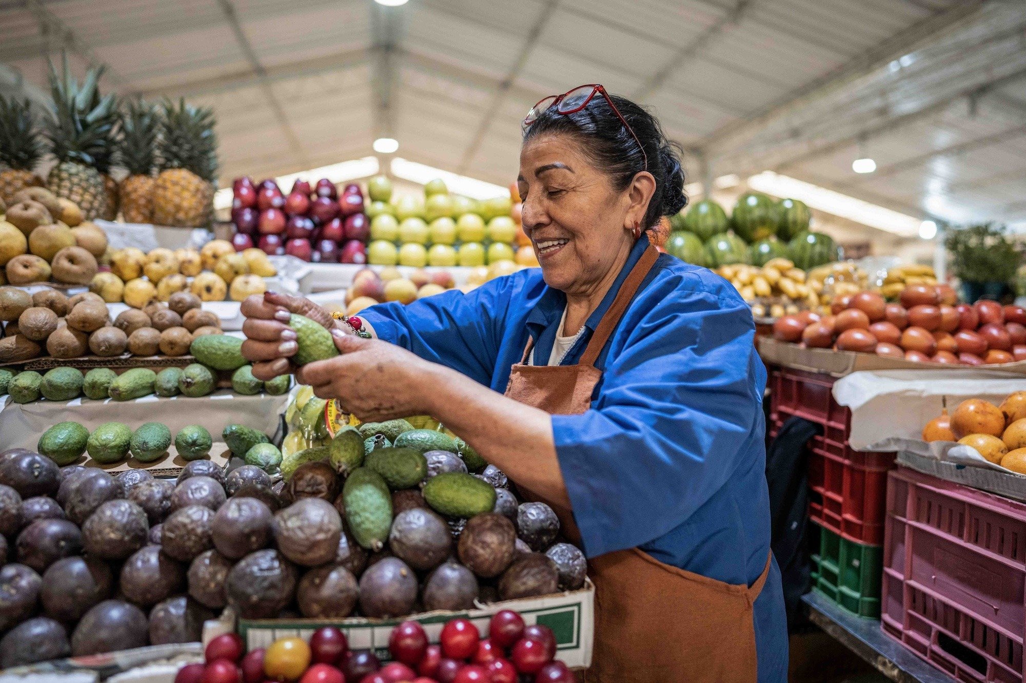 Woman working in fruit stand