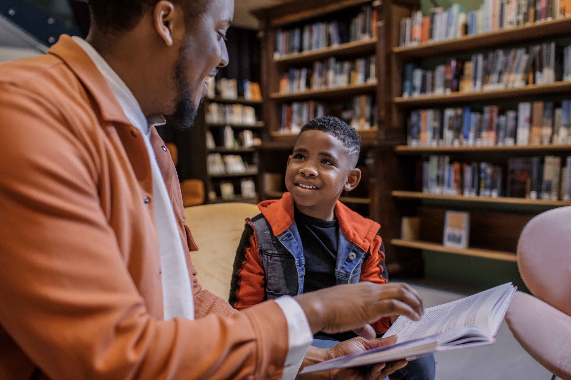 Adult and child reading
